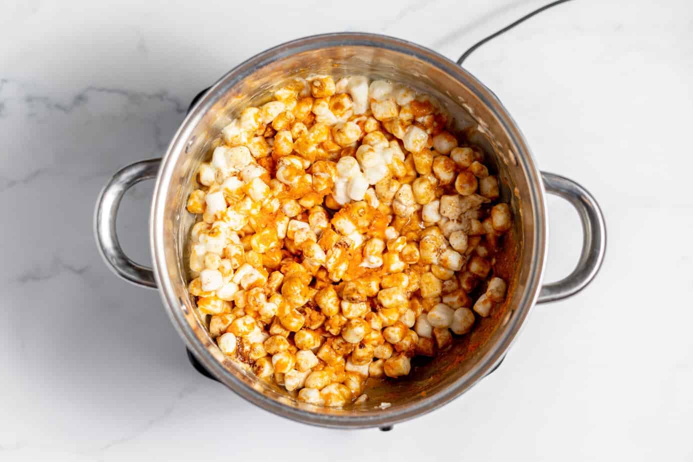 butter, pumpkin pie spice, pumpkin puree, vanilla, marshmallows and butter in a pan mixed up