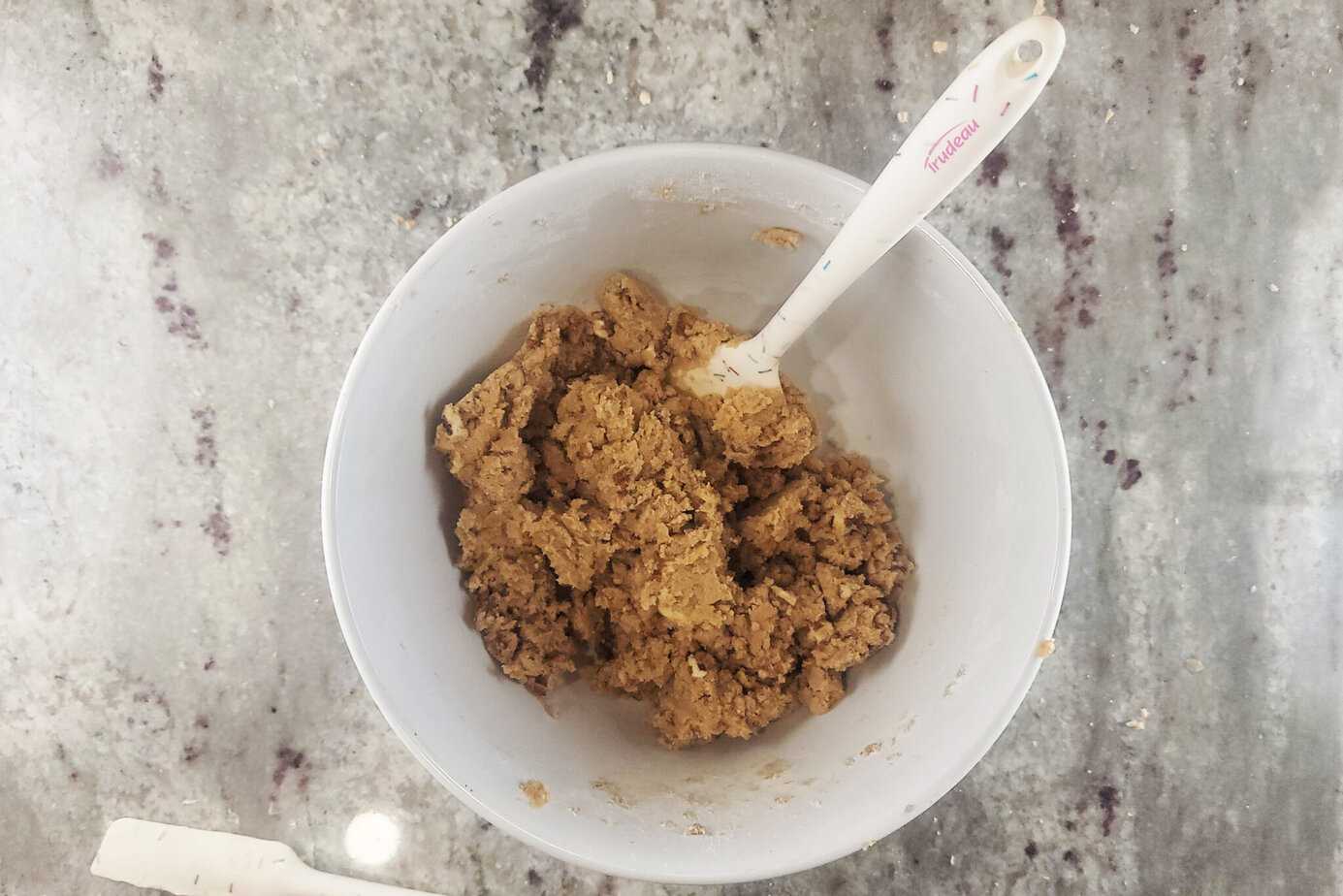 mixing ingredients for Pecan Praline Cookies  with silicone spatula