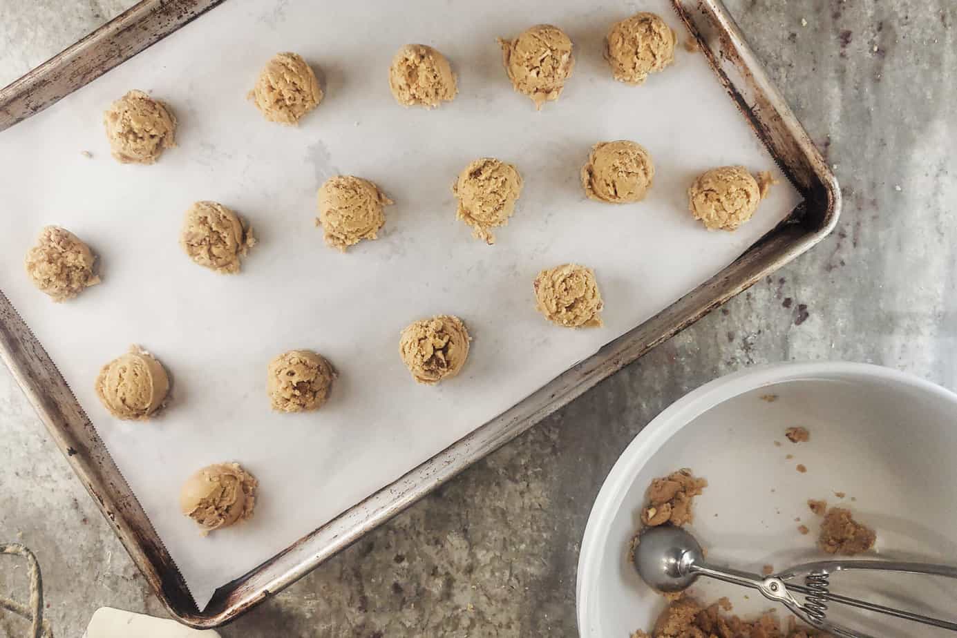 balls of scoop of Pecan Praline Cookies dough  on a cookie sheet
