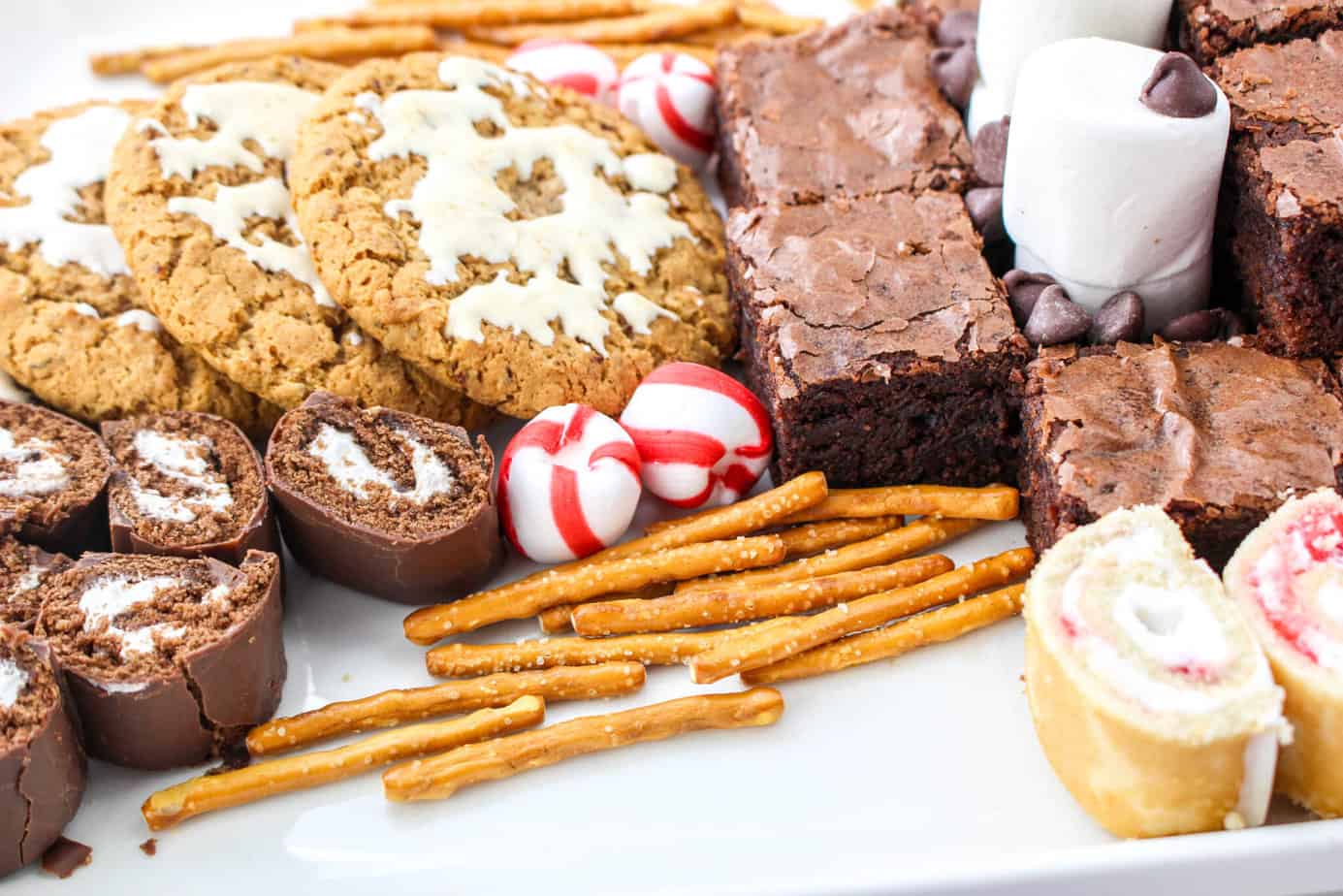 adding pretzels for antelers on Rudolph charcuterie board