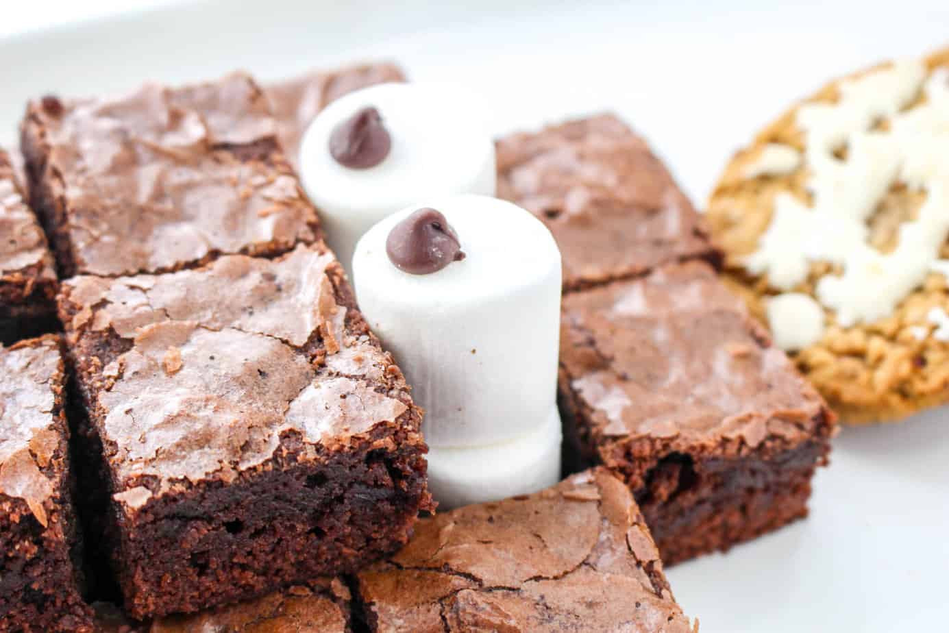 using marshmallows for eyes on holiday dessert charcuterie board