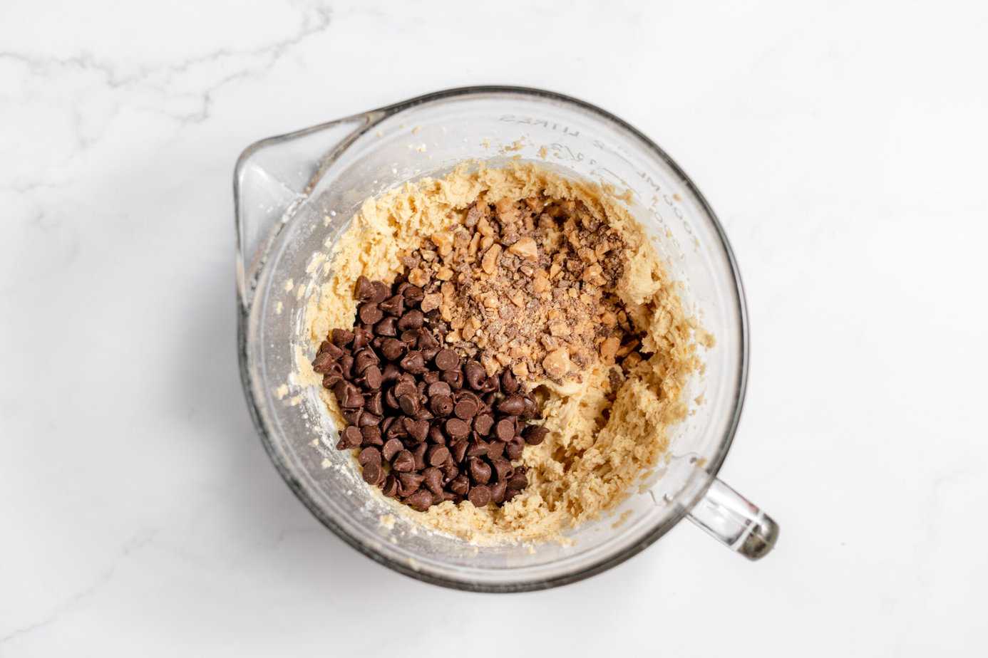 chocolate chips and toffee chips added to cookie dough