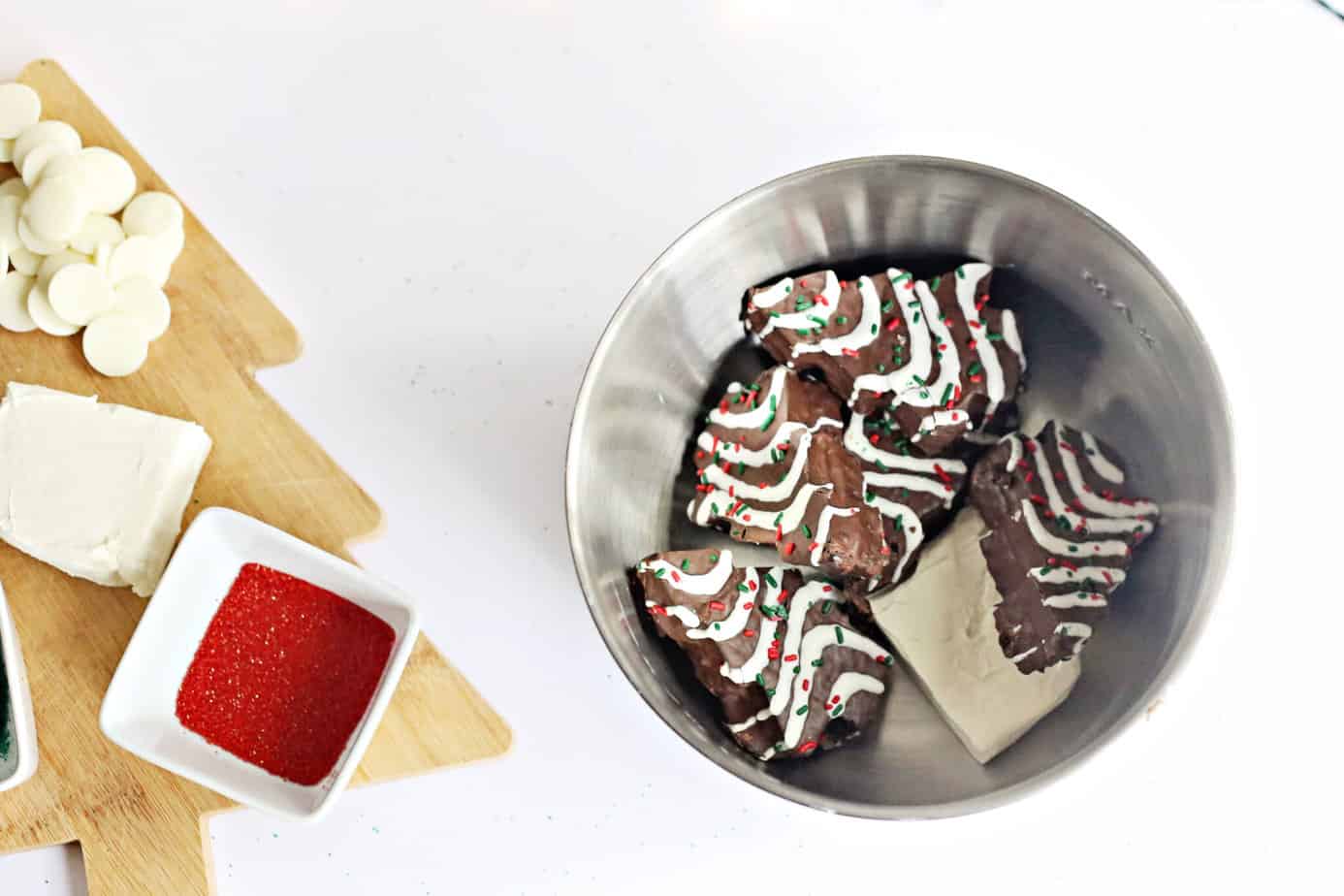 Chocolate Little Debbie Christmas Tree Cakes in a bowl with cream cheese