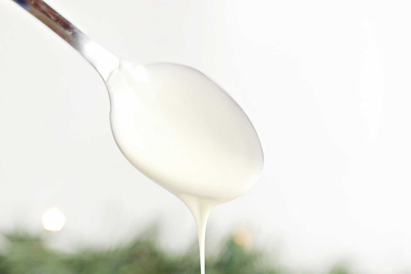 melted white chocolate dripping off a spoon