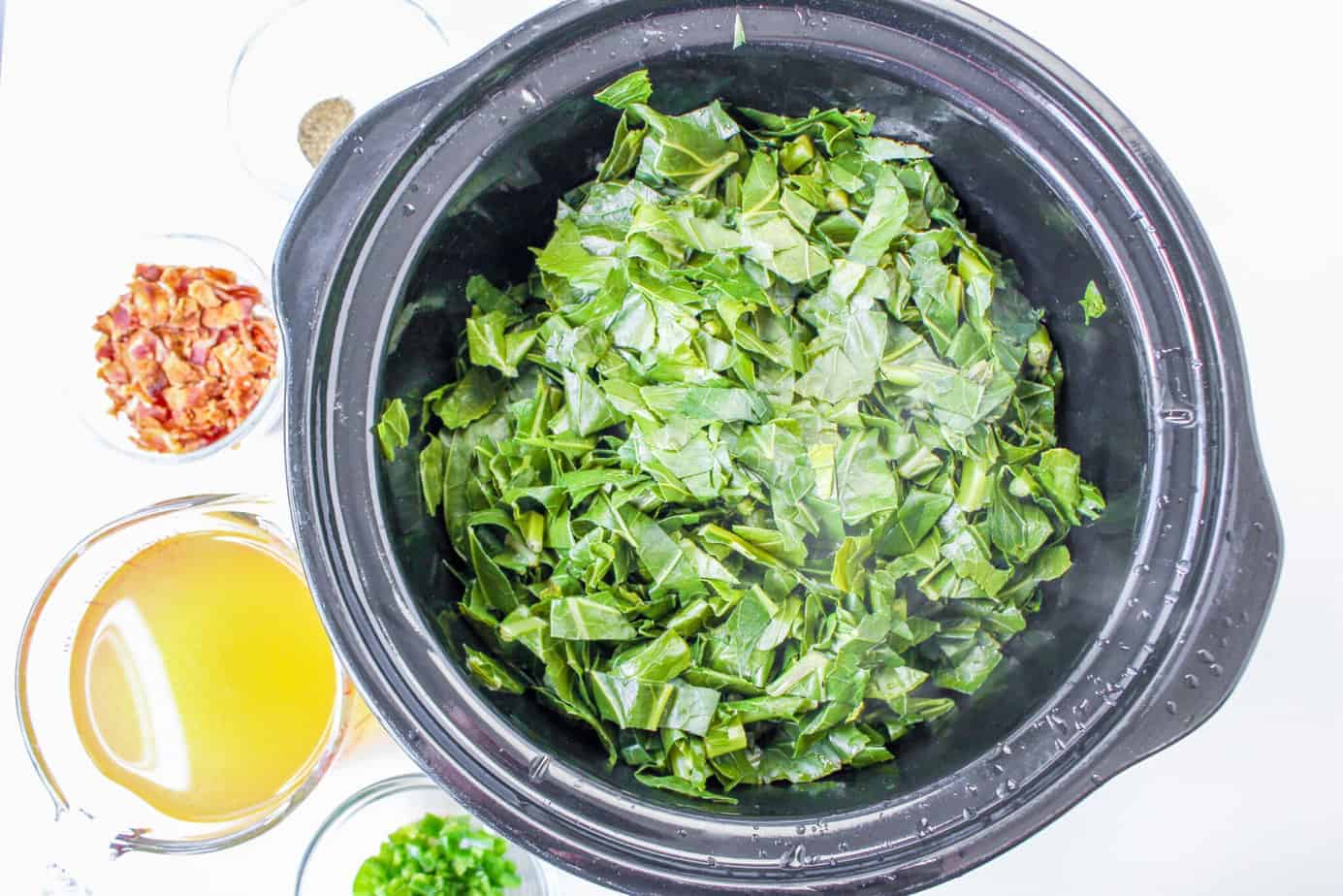 fresh collard greens in a slow cooker