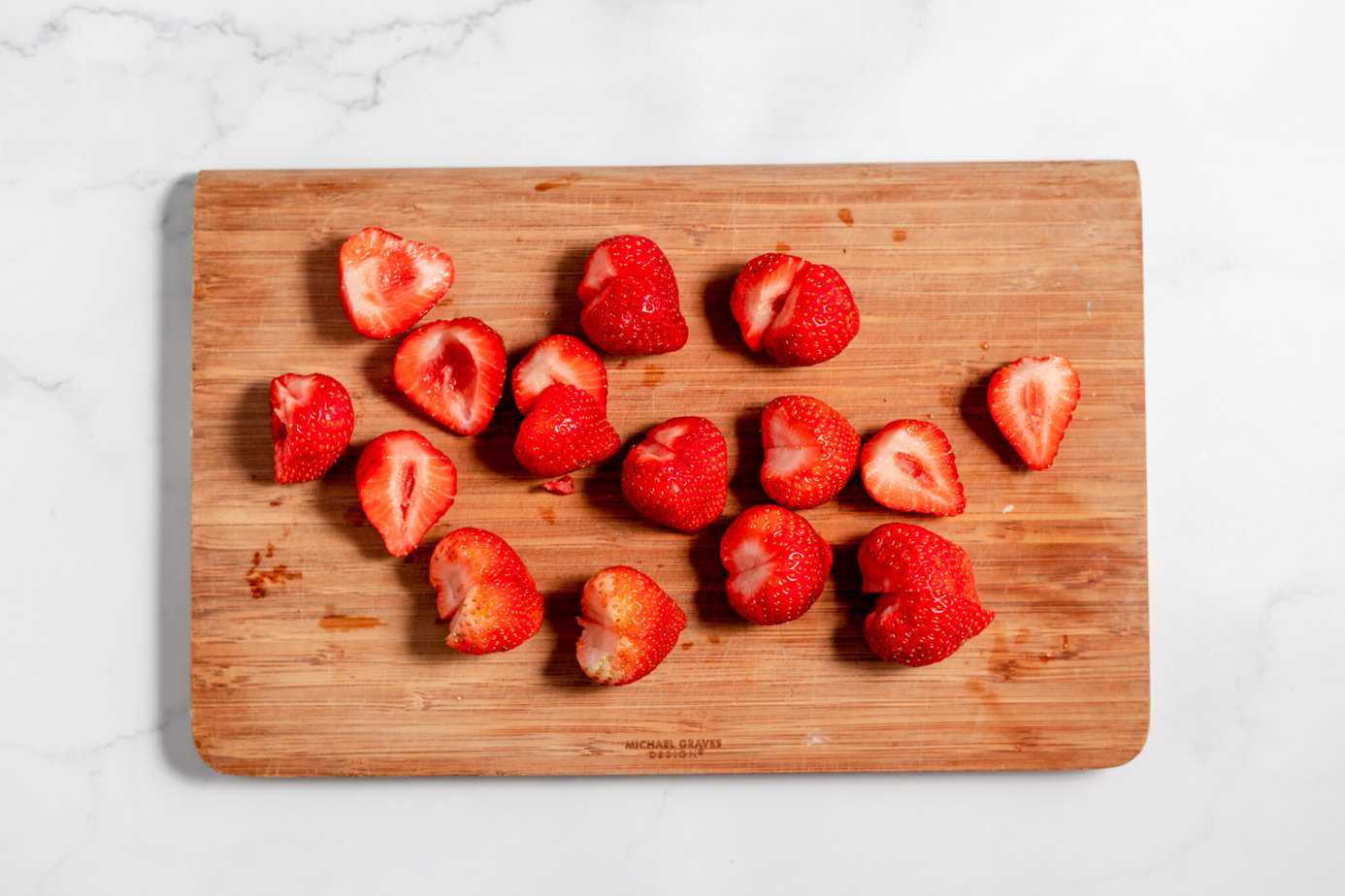 strawberries cut in half with the top cut off