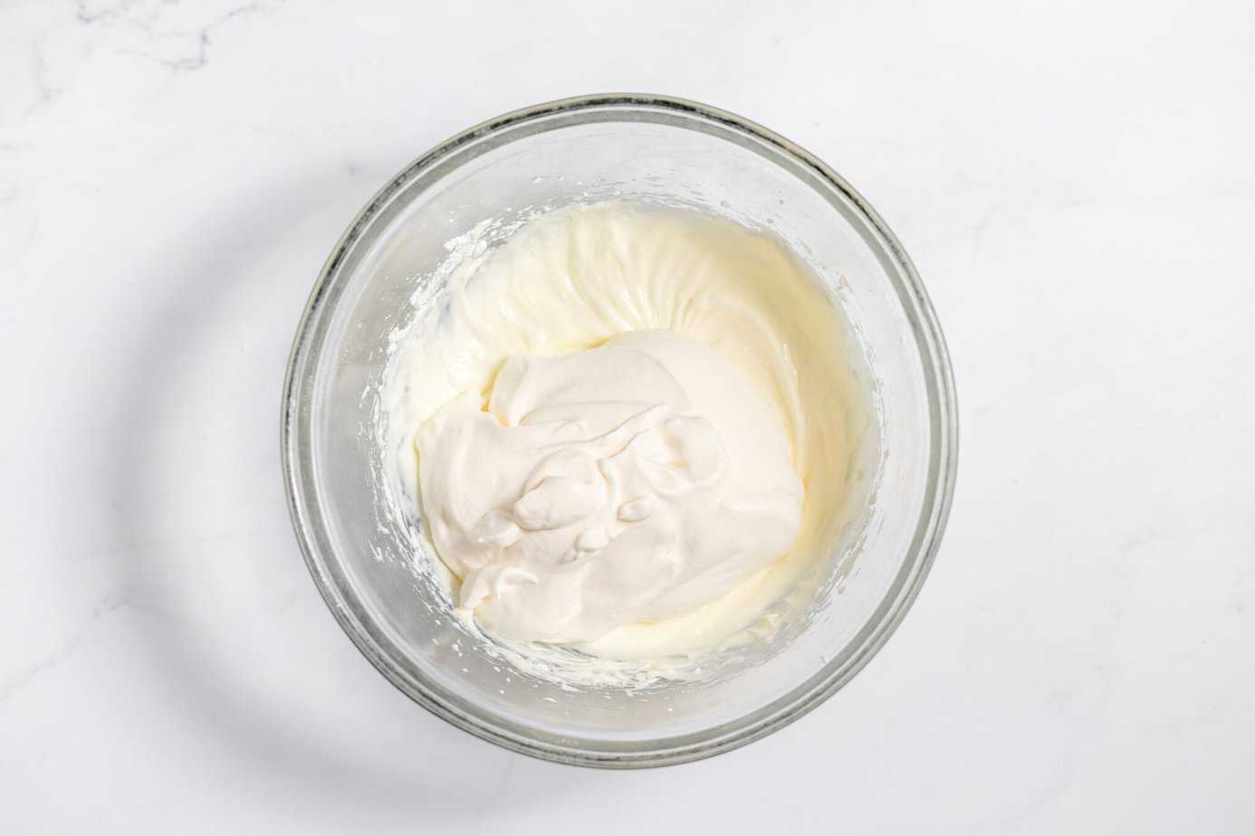 whipping cream on top of cream cheese mixture