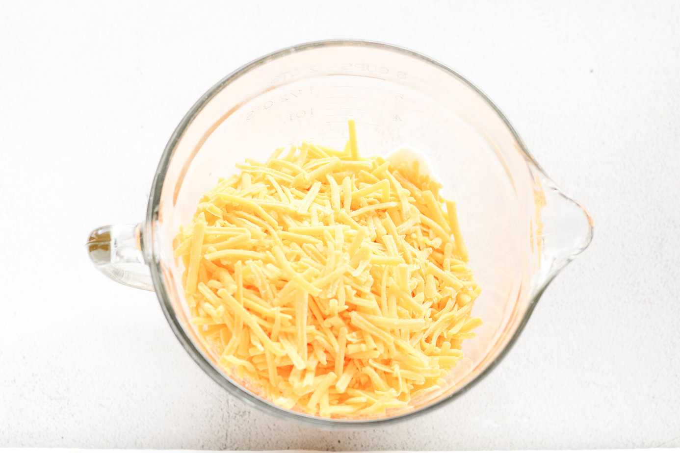 Rojos Street Corn Dip ingredients in a clear measuring bowl