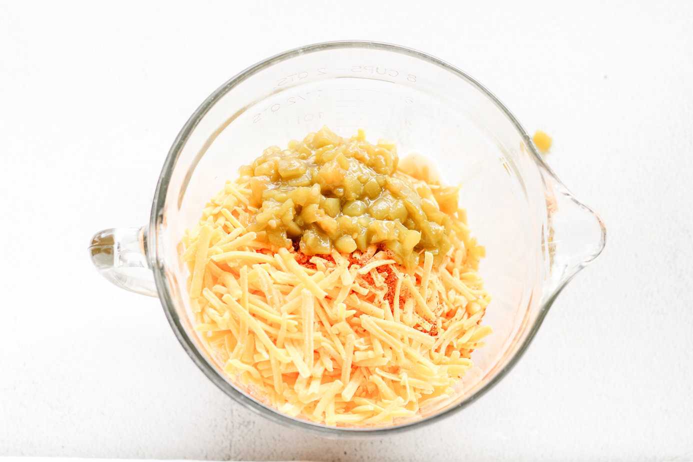 Rojos Street Corn Dip ingredients in a clear measuring bowl
