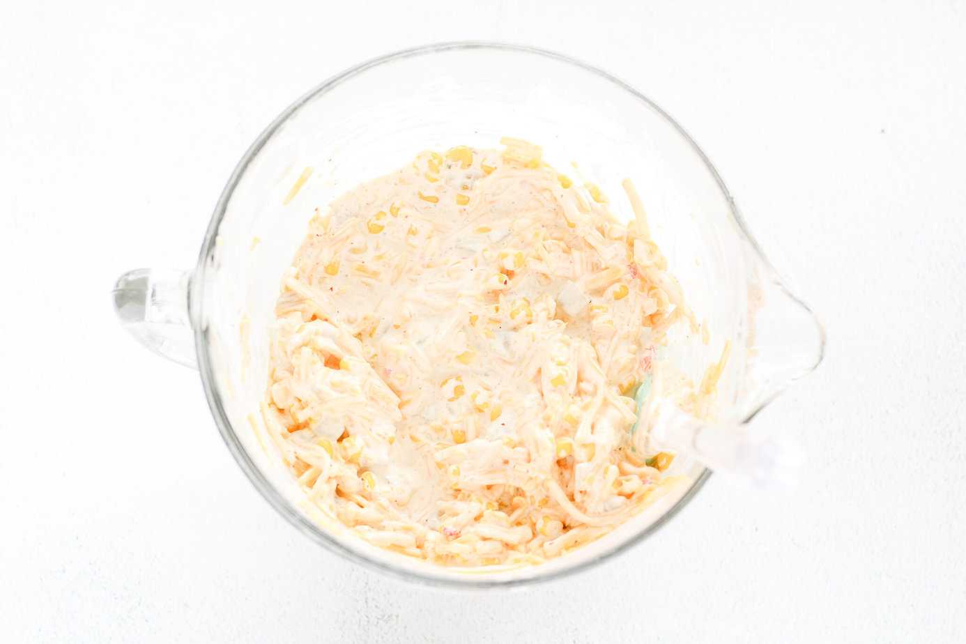 Rojos Street Corn Dip ingredients in a clear measuring bowl