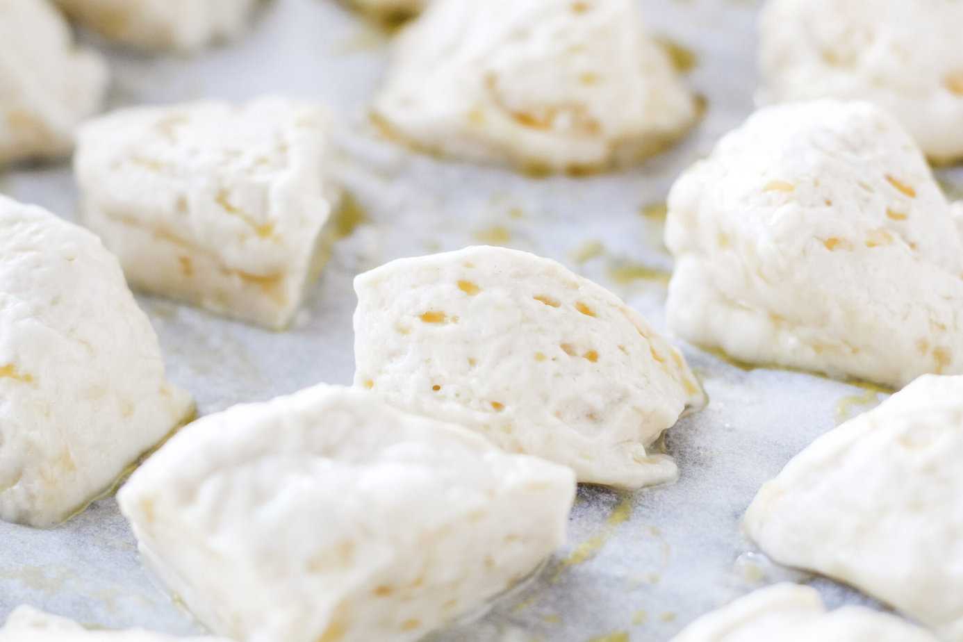 water dipped biscuit dough on parchment paper