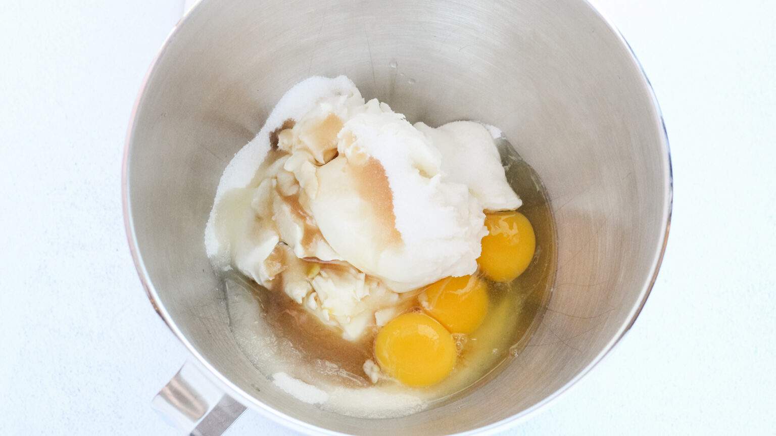 cream cheese, vanilla, sugar and eggs, in a mixing bowl