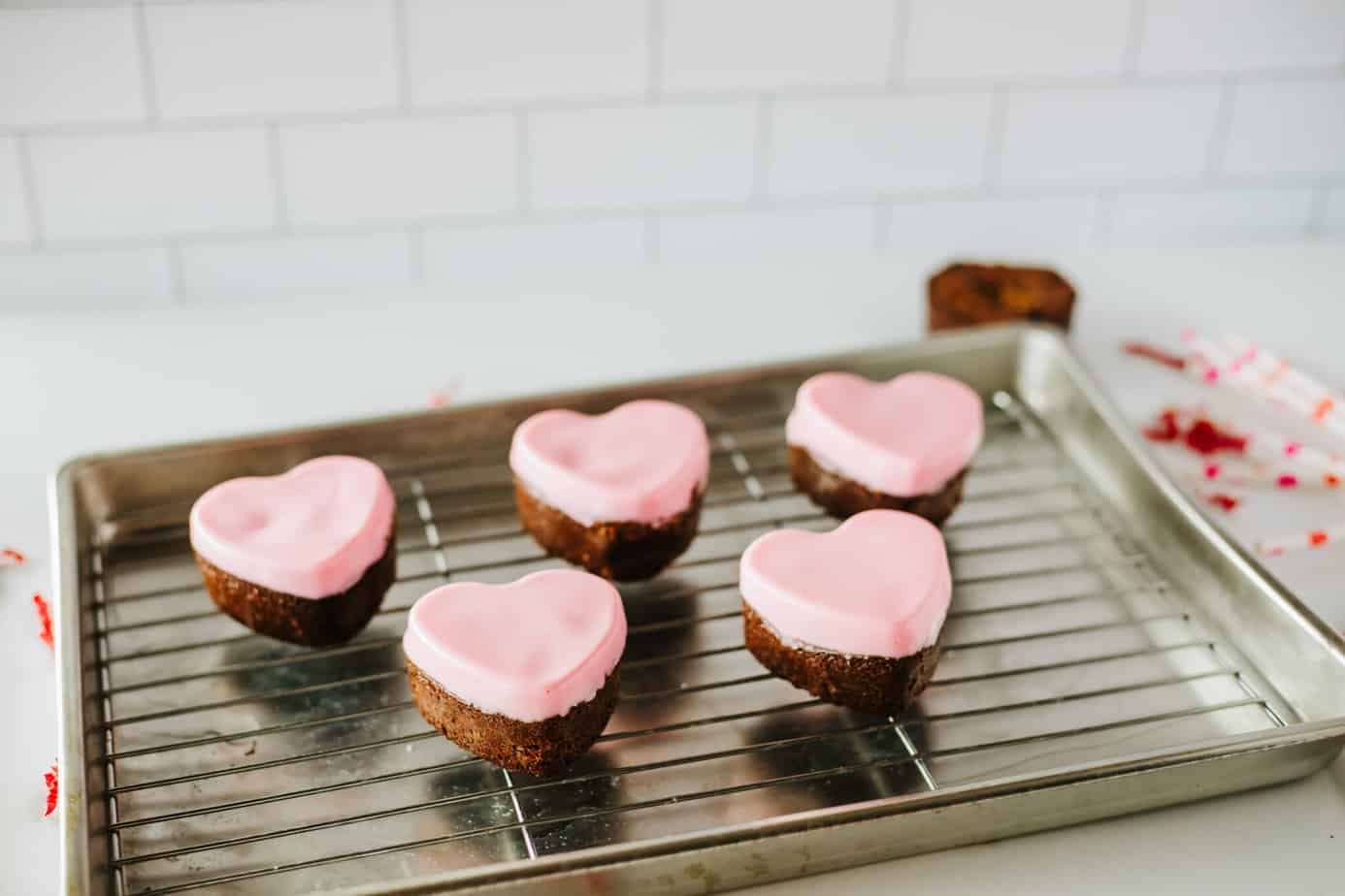 Heart Brownies on a wire rack with pink chocolate on top