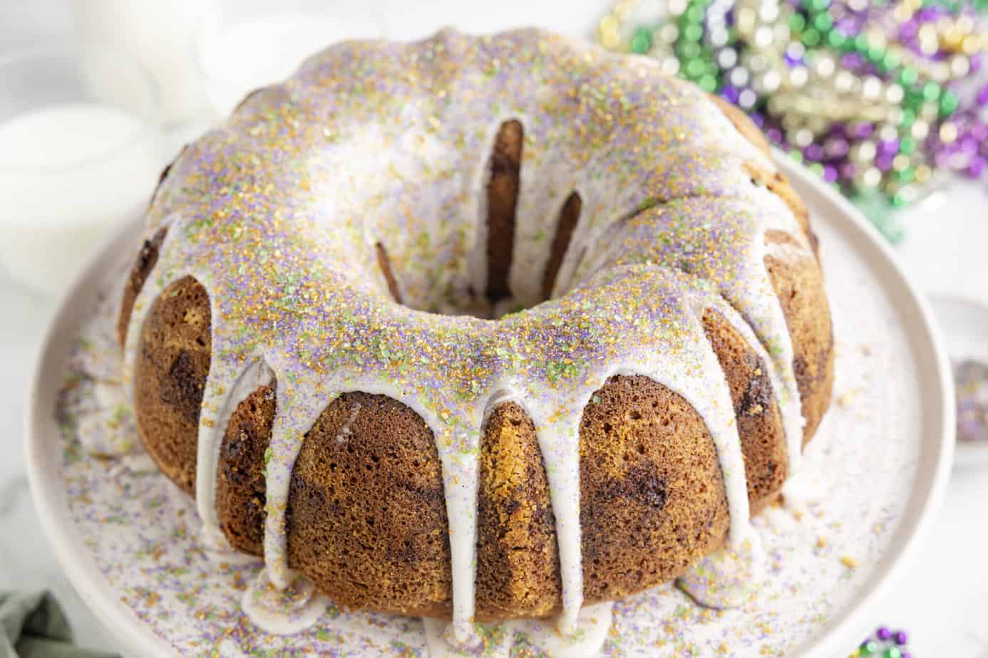 Cinnamon Bundt Cake on a white cake stand