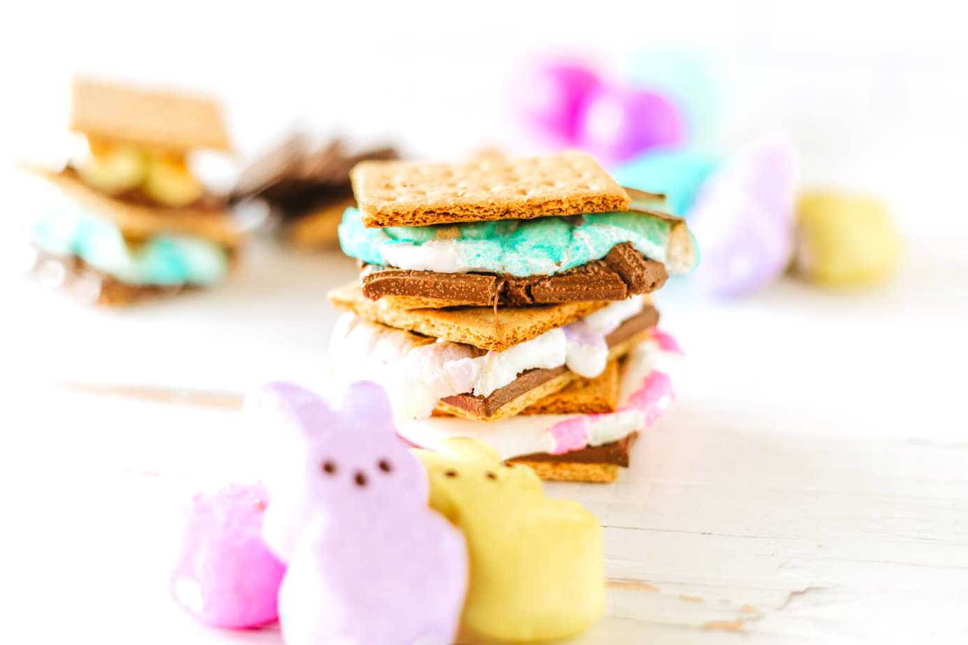 s'mores made with peeps lying on a white surface