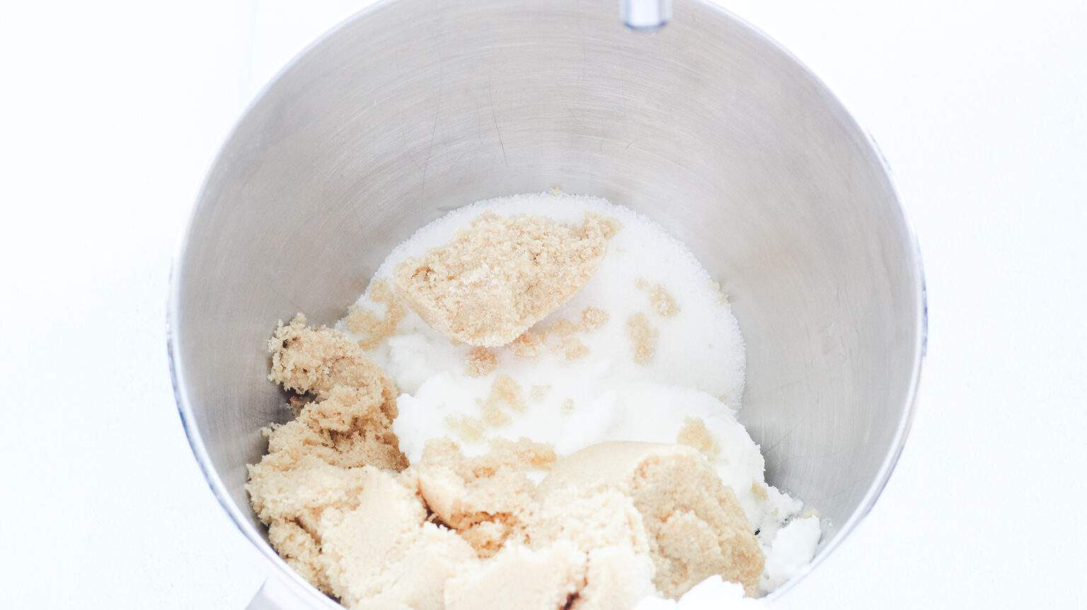 shortening, sugars and baking soda mix in bowl