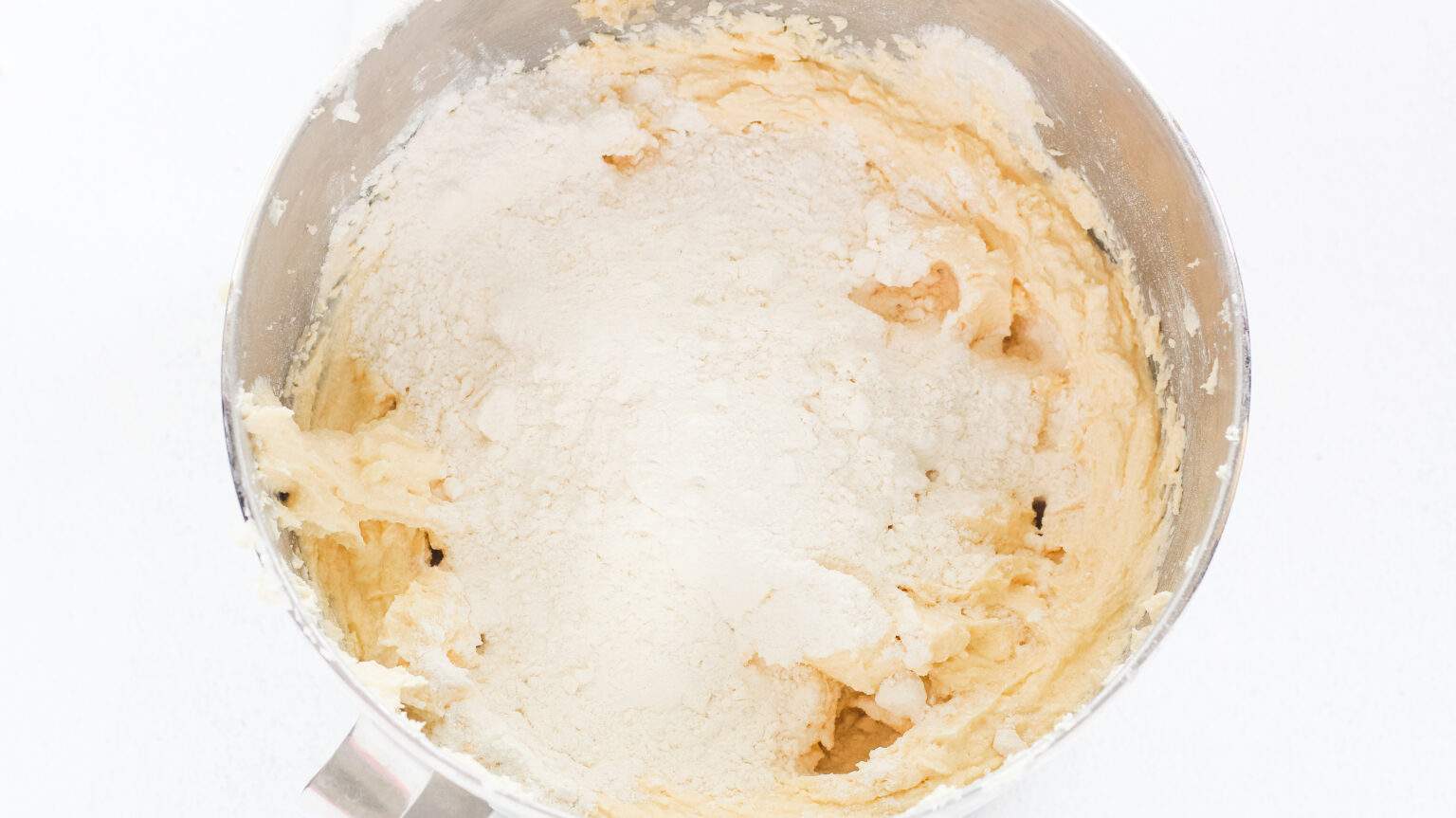 shortening, sugars and baking soda mix in bowl mixed up with flour added