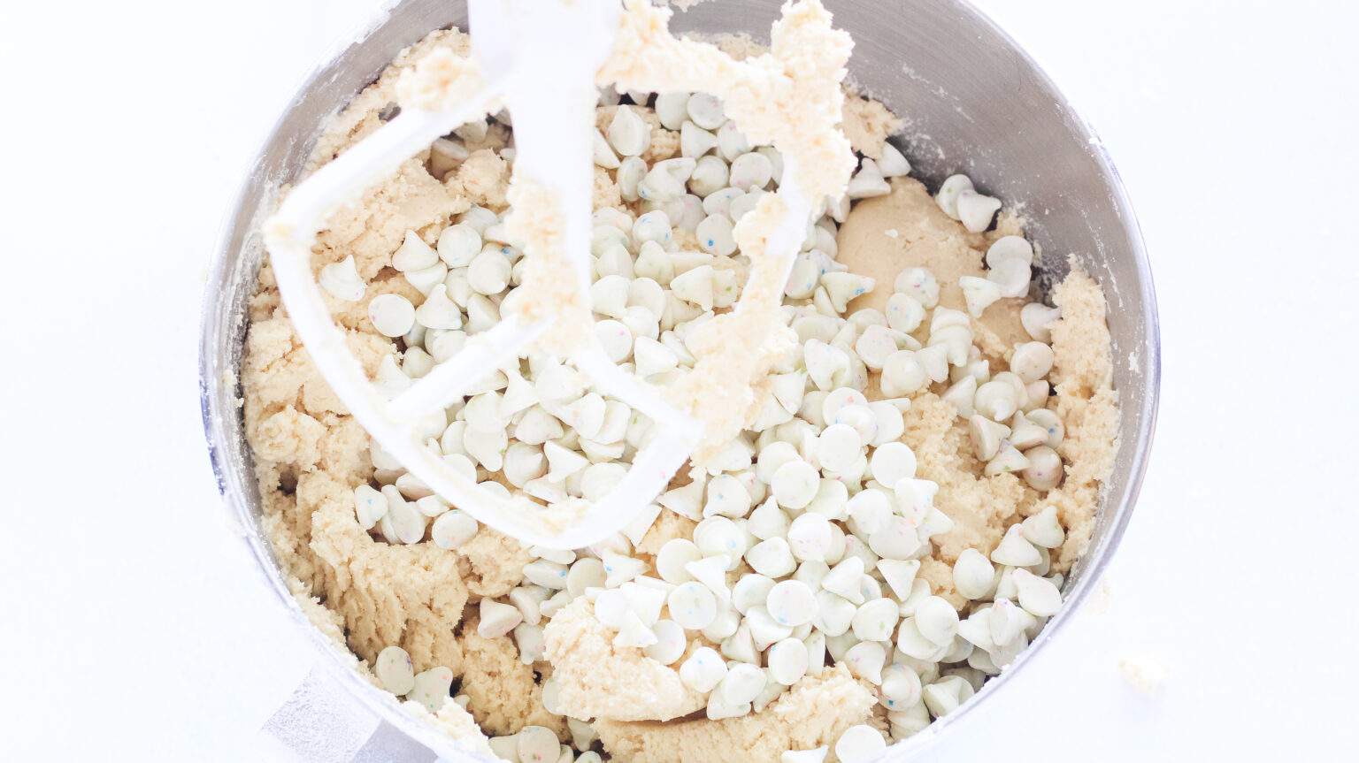 easter skillet cookie batter mixed up with white chocolate chips added