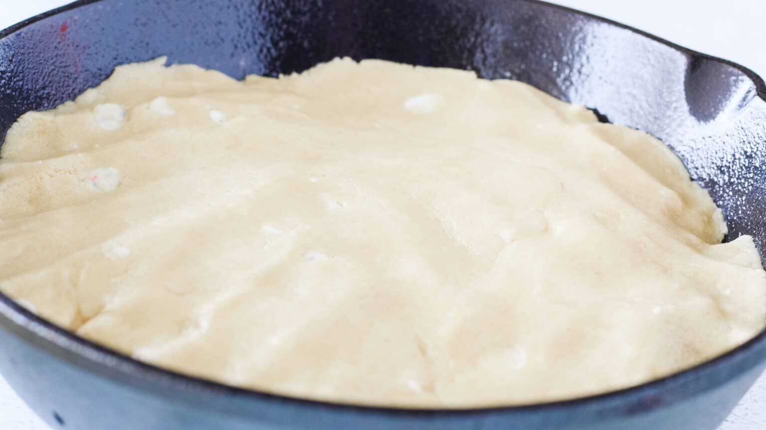 easter skillet cookie dough pressed into cast iron skillet