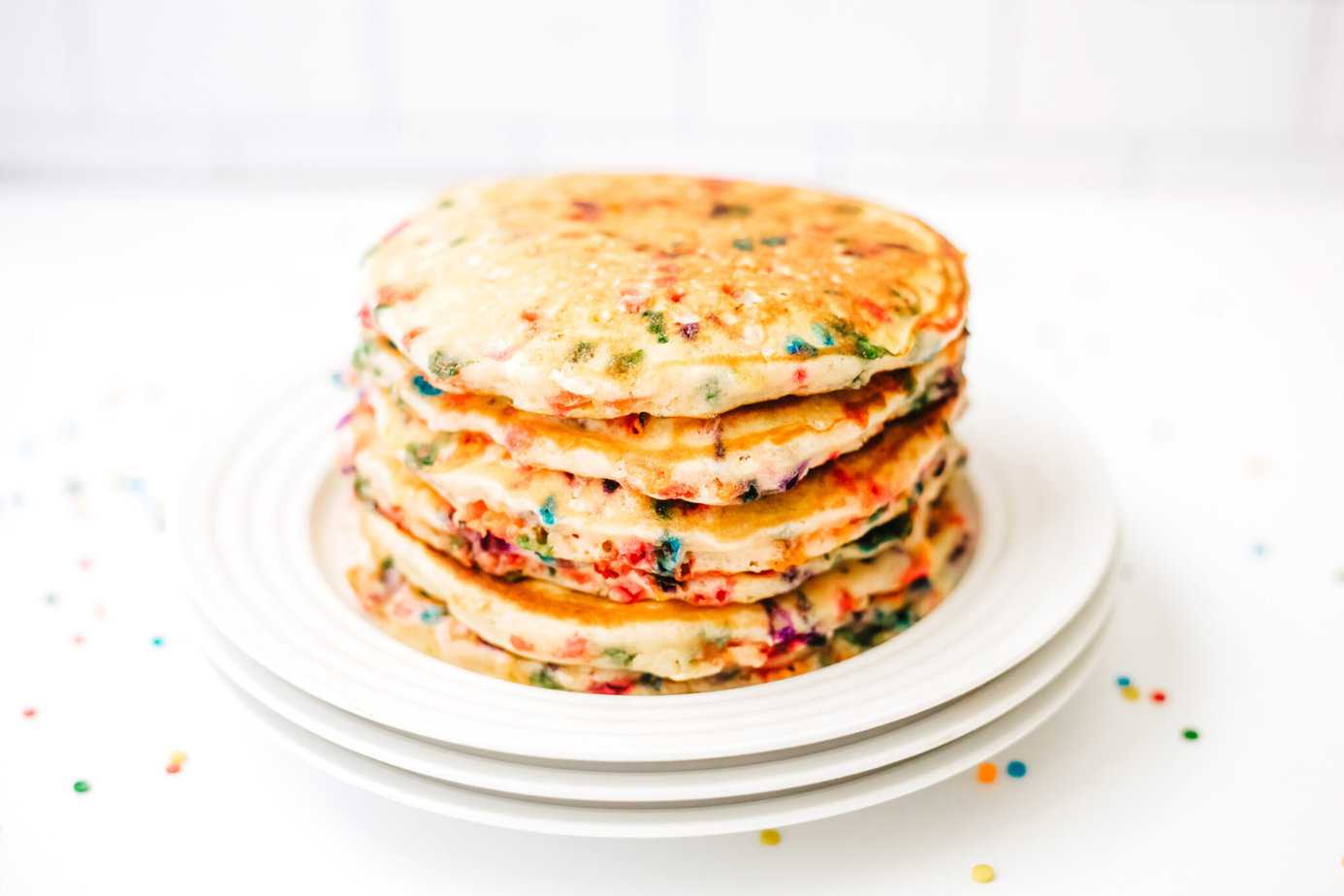 stack of funfetti cupcakes on a white plate
