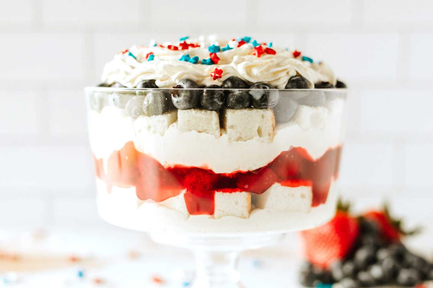 Red, White and Blue Trifle in a trifle dish with star sprinkles on top