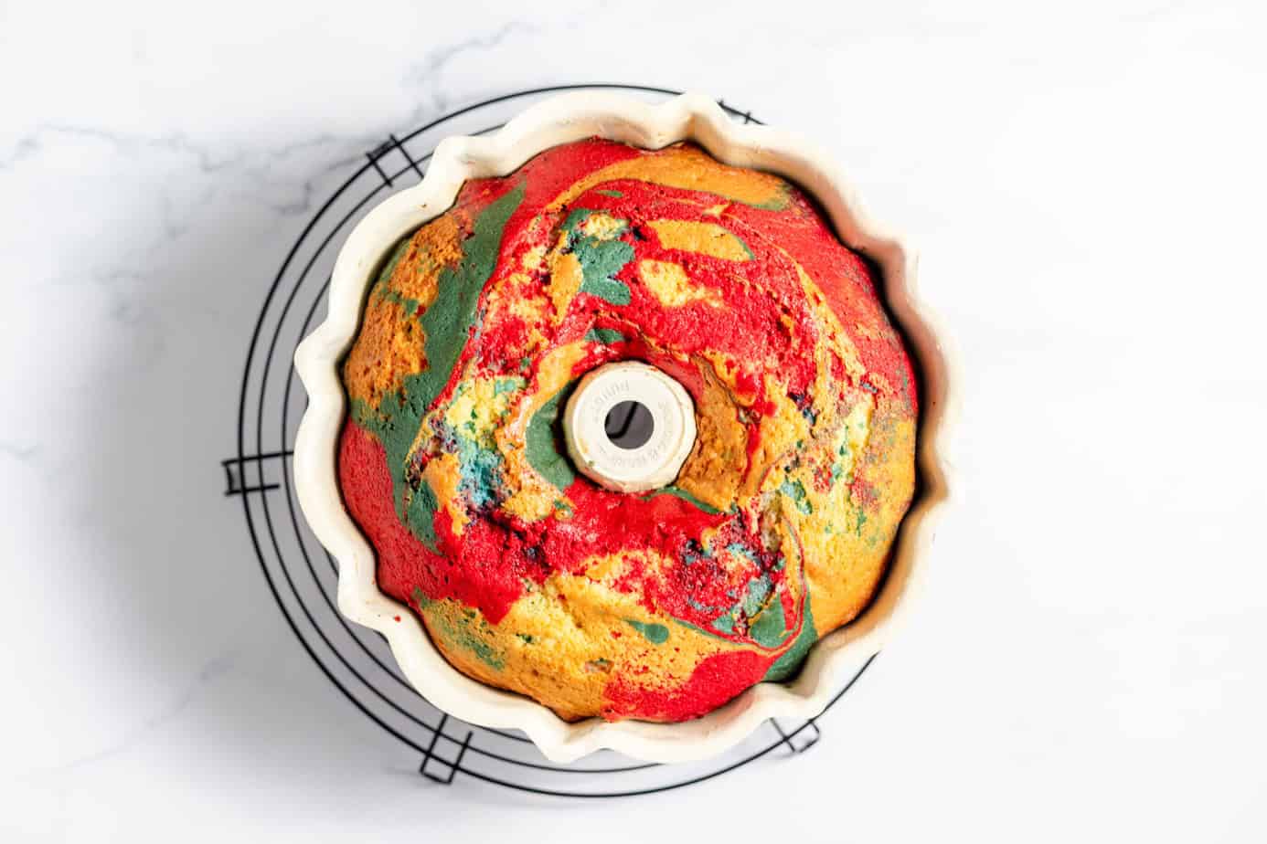 red white and blue cake baked in bundt pan on cooling rack
