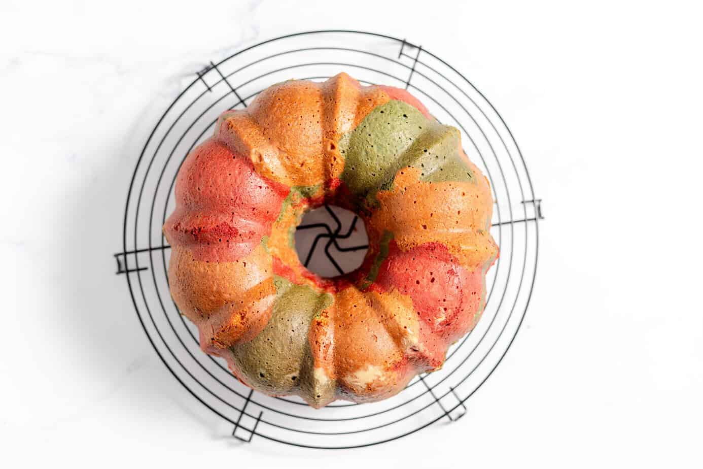 red white and blue bundt cake on cooling rack