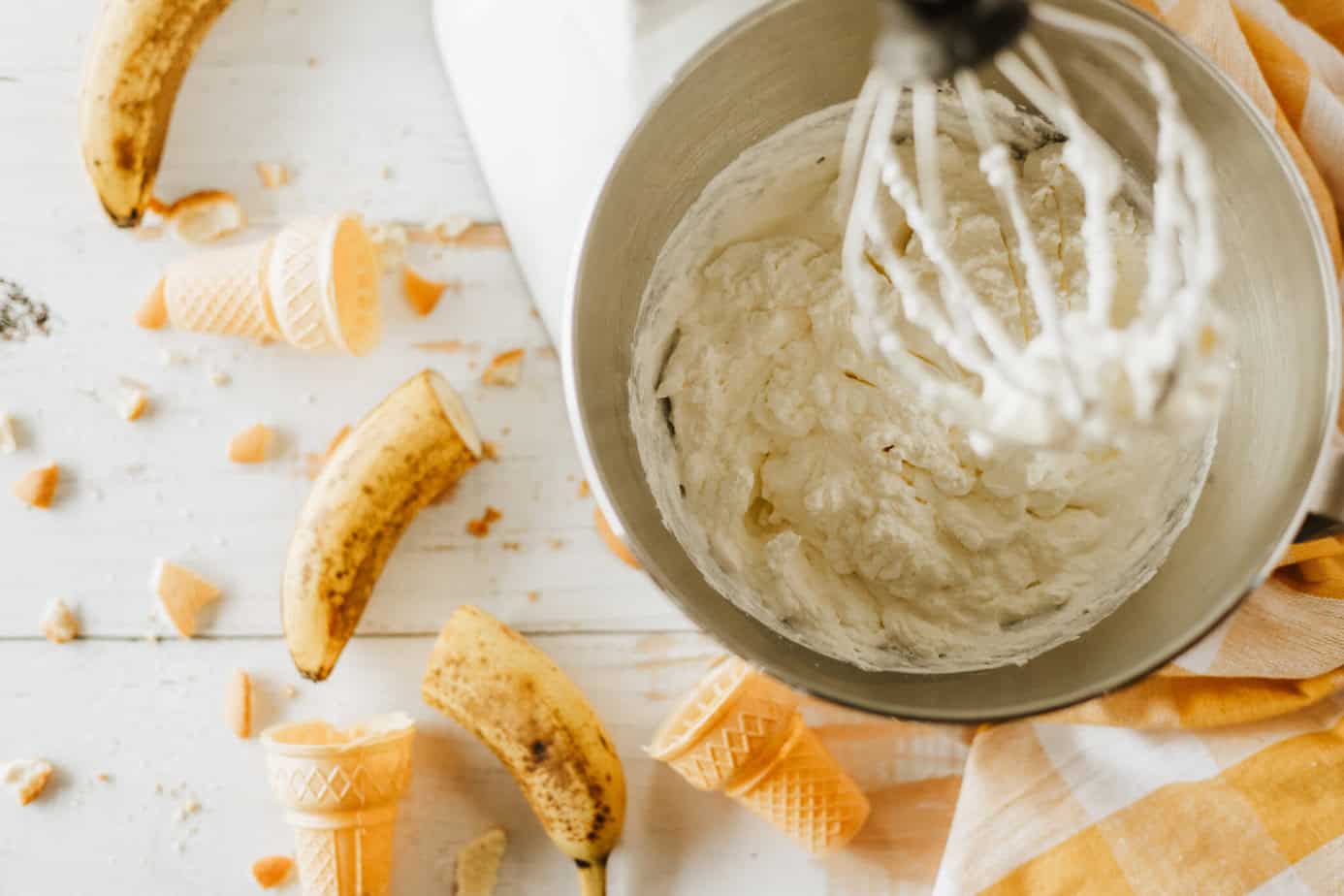 whipping heavy cream in a mixing bowl