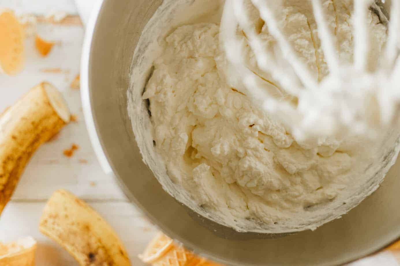 whipping heavy cream in a mixing bowl