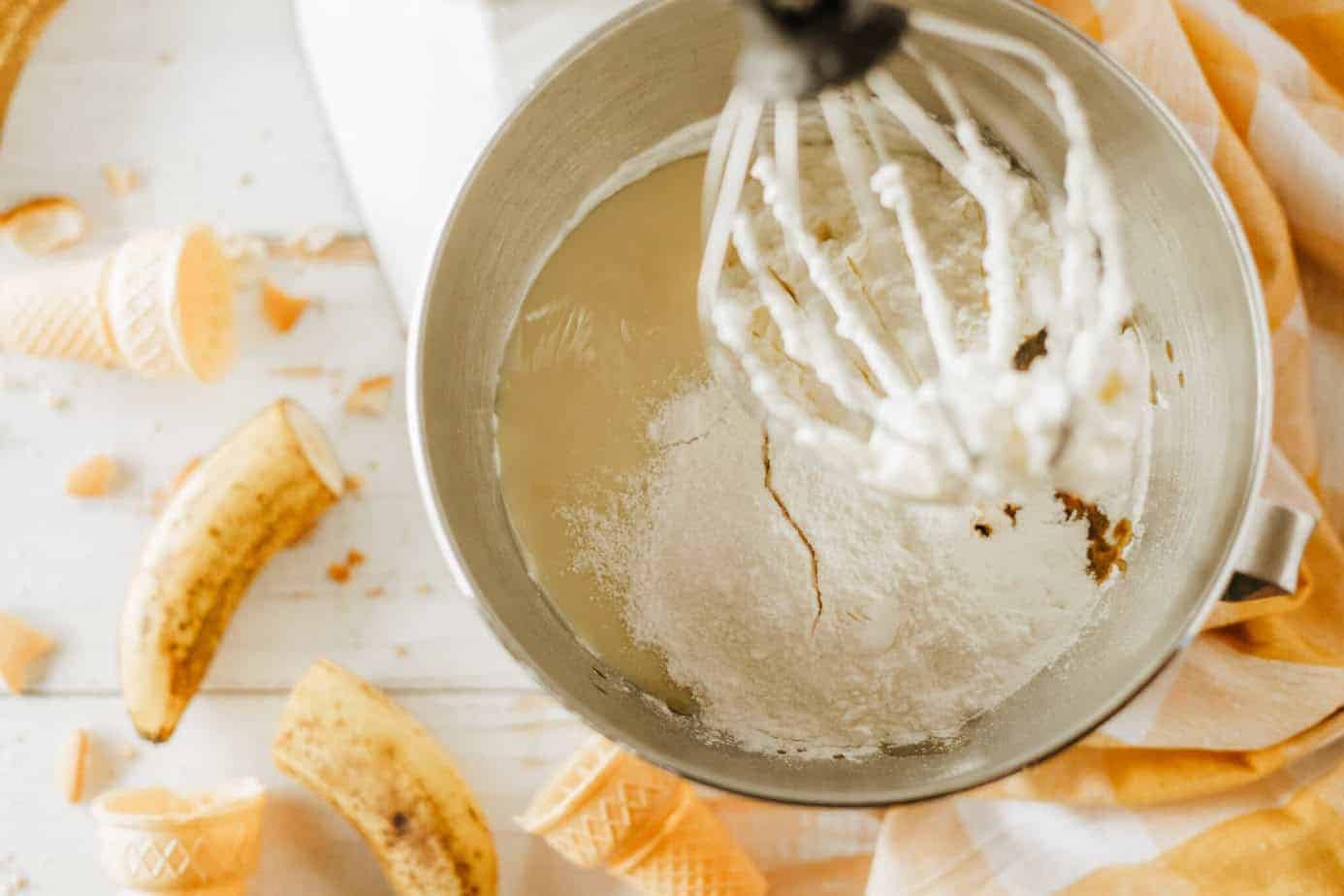 adding vanilla, condensed milk and pudding mix to the whipped cream