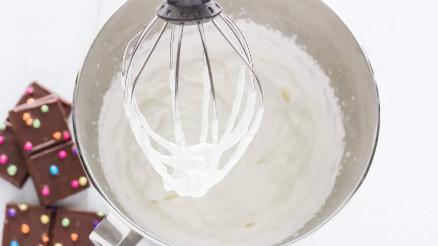 whipping cream in a mixer bowl