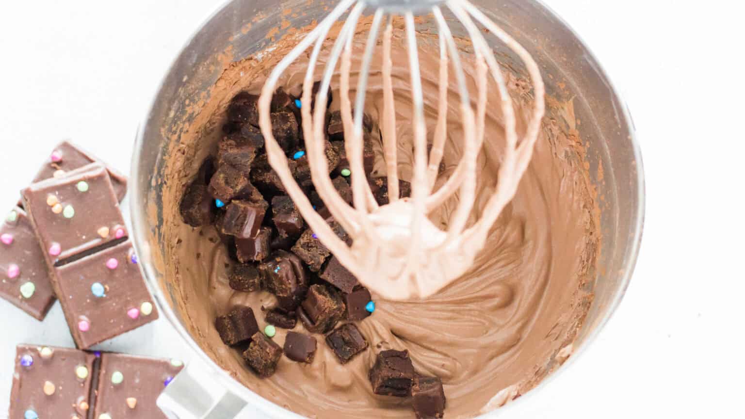 adding brownie chunks to mixer bowl