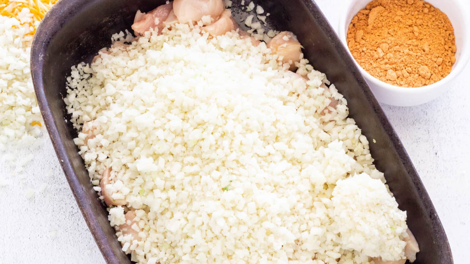 cauliflower rice added on top of the chicken