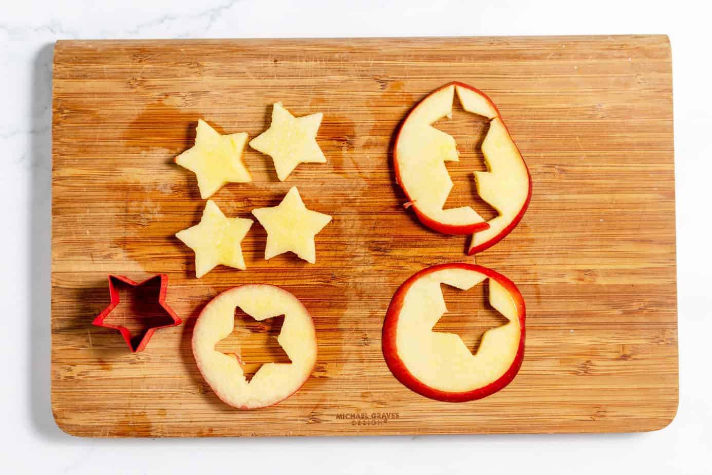 star cookie cutter cutting star shapes out of the apple slices