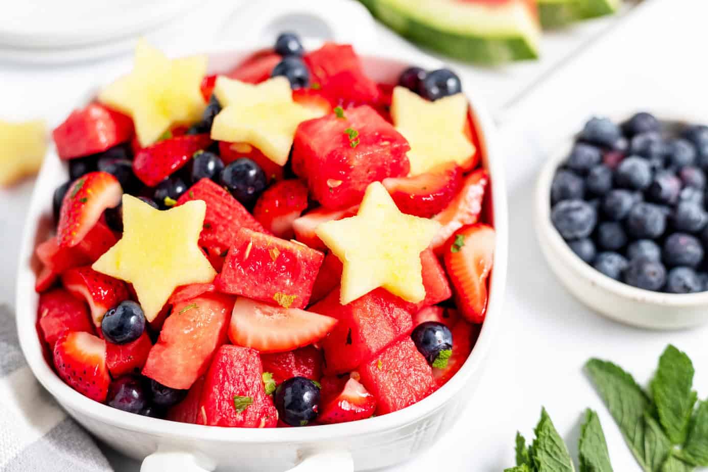 Patriotic red white and blue fruit salad with star apples