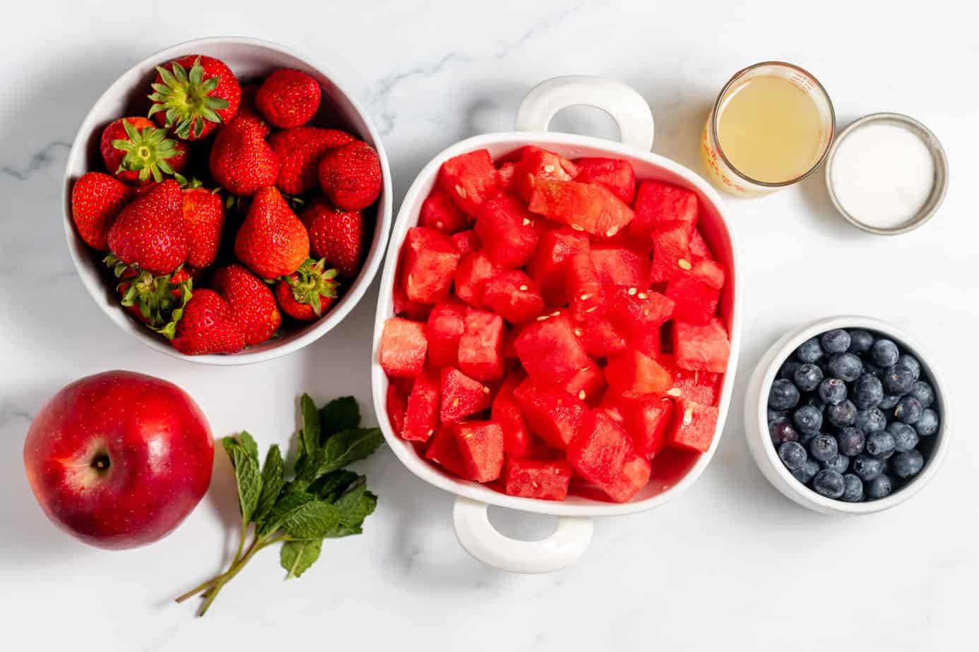 Ingredients to make a patriotic fruit salad