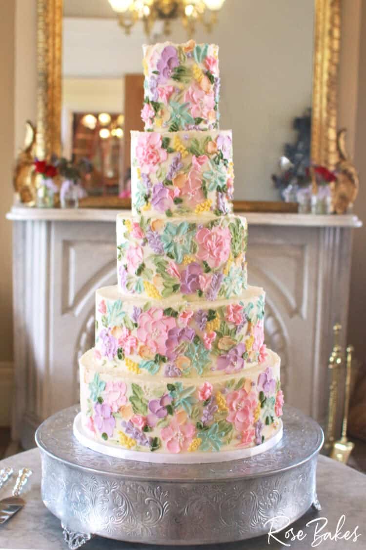 Bridgerton-Inspired Wedding Cake with pastel buttercream pallete painted floral design
