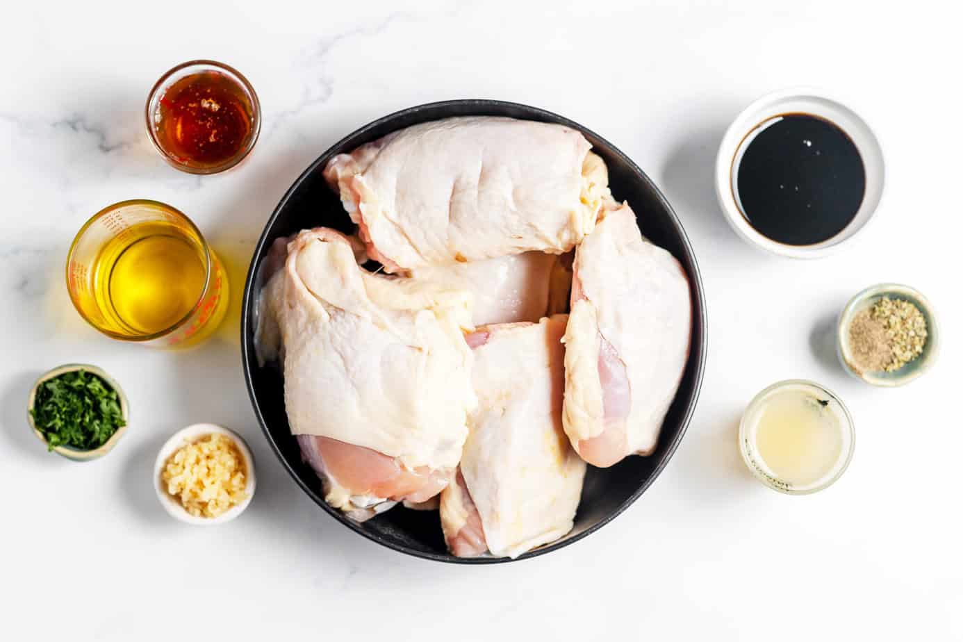 chicken marinade ingredients plus raw chicken thighs
