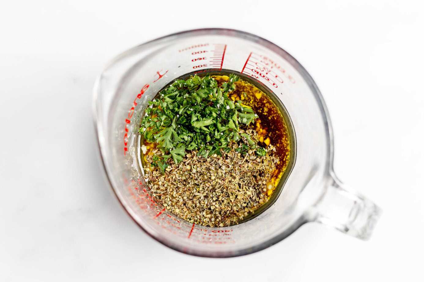 marinade ingredients in a glass measuring cup