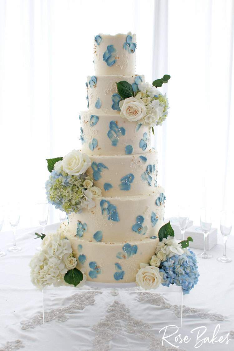 Palette Painted Wedding Cake with Blue petals and sugar pearls plus real hydrangeas