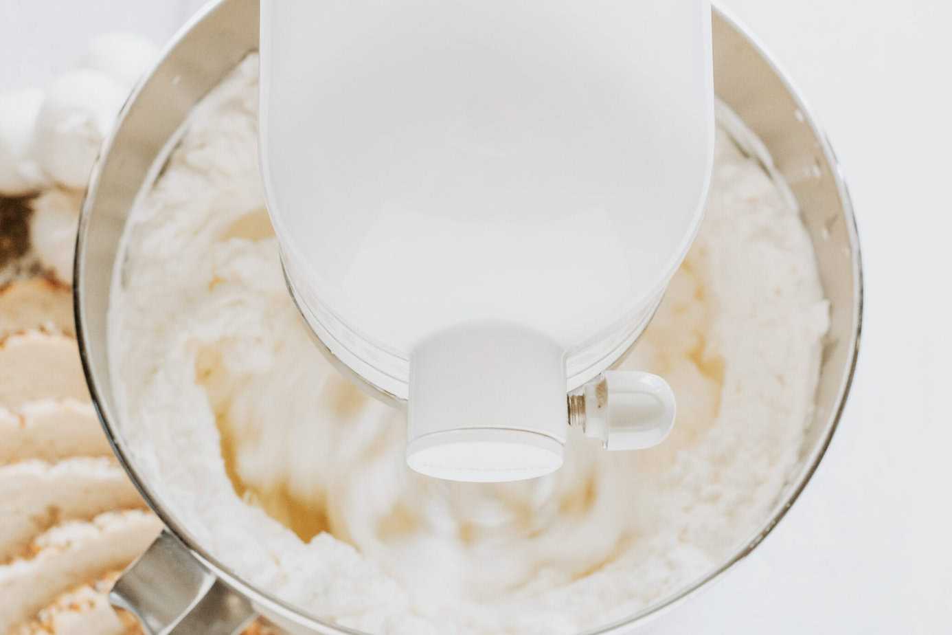 whipping heavy cream in a mixer bowl