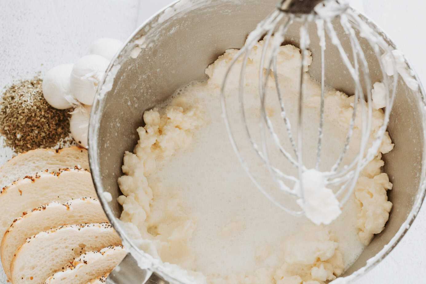 heavy whipping cream mixed until it's separated in a kitchenaid mixing bowl