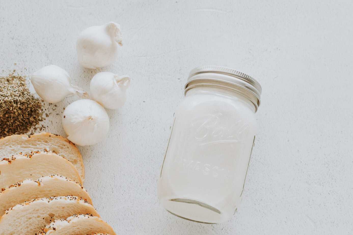 buttermilk in a jar on a white surface