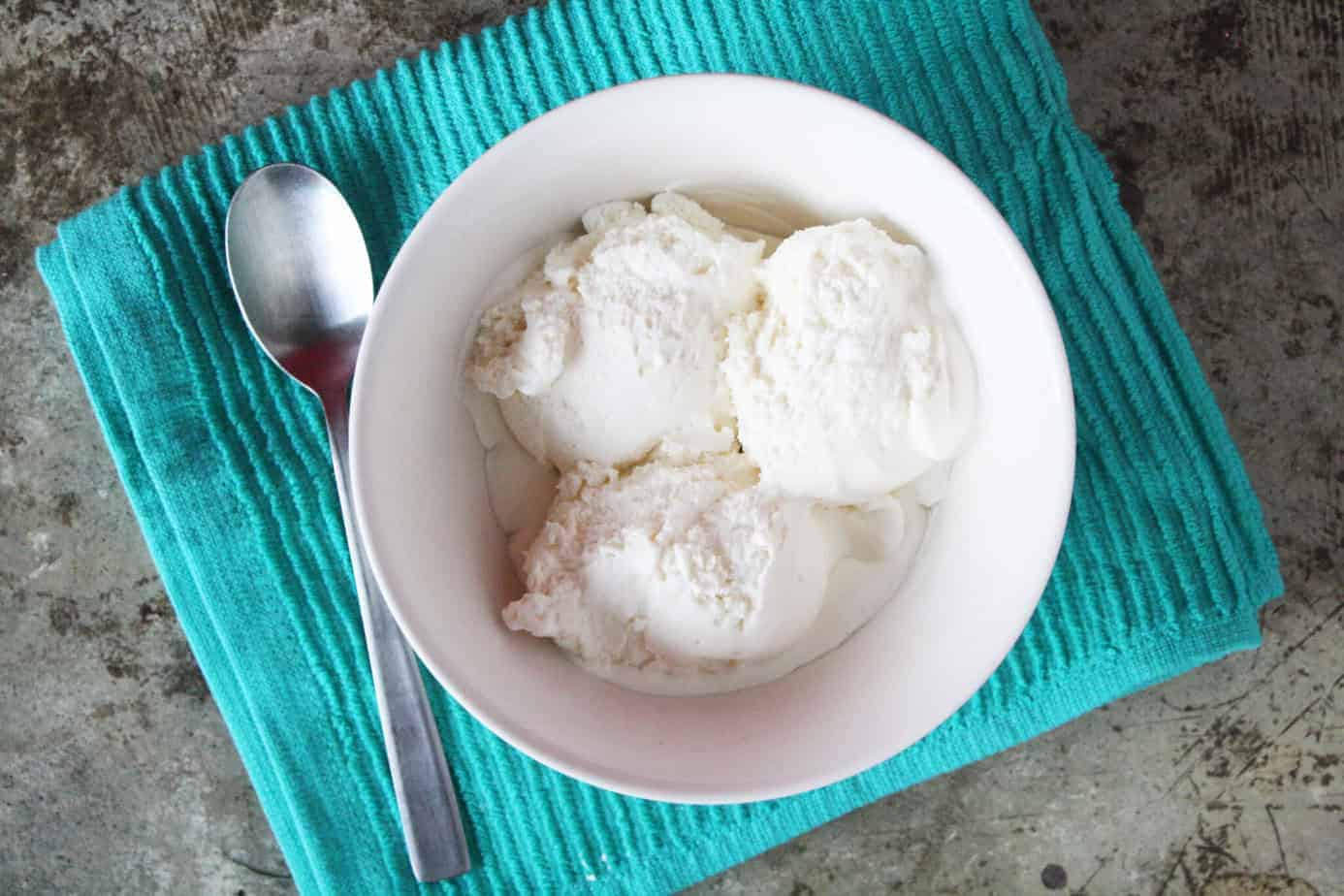 scoops of kitchenaid vanilla ice cream in a white bowl