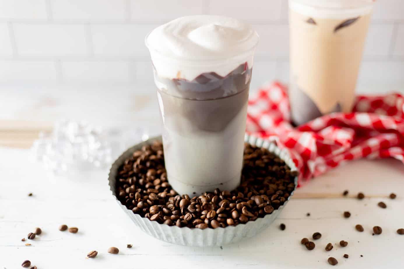 finished crackle coffee in a bowl of coffee beans on a white surface
