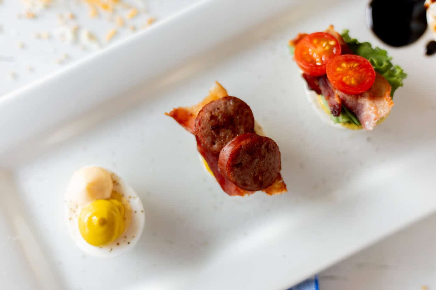 sausage and bacon on egg