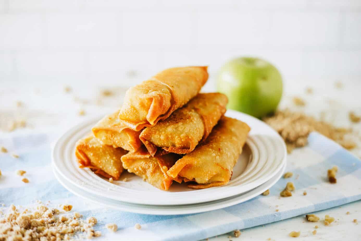 fried apple pie rolls on white plates