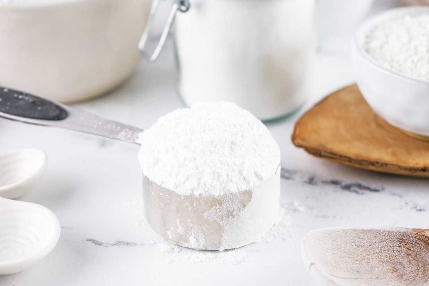 homemade powdered sugar in a silver measuring cup