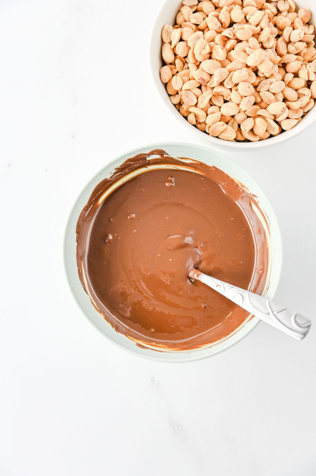melted chocolate and peanut butter chips in a bowl