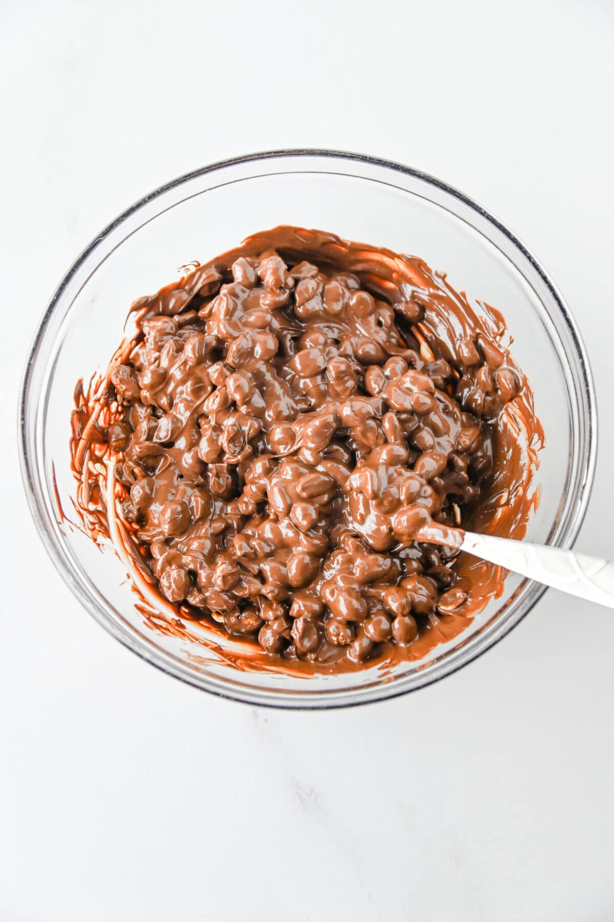 peanuts mixed into melted chocolate and peanut butter chips
